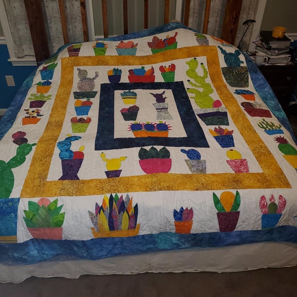 Handmade-machine quilted Queen/King quilt.